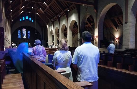 A picture containing clothing, person, person, church

Description automatically generated