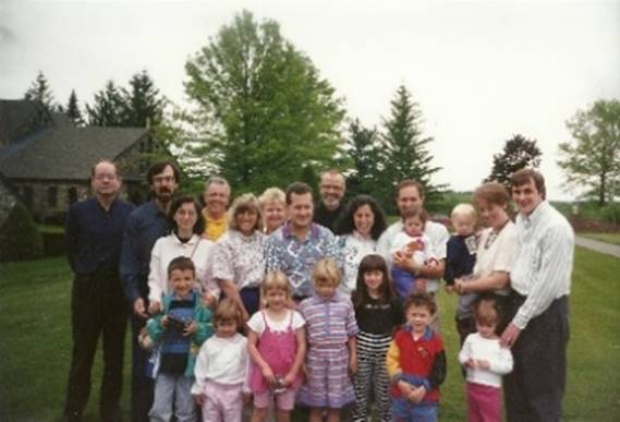 A group of people posing for a photo

Description automatically generated